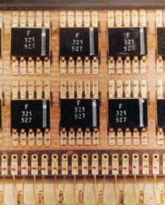 Fairchild Block II flat package ICs on a printed circuit board. Photo: Charles Stark Draper Laboratory Archives